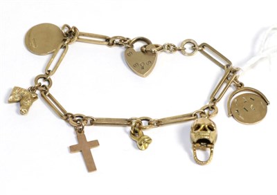 Lot 31 - A 9ct gold charm bracelet set with seven charms
