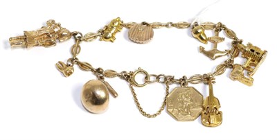 Lot 37 - A 9ct gold charm bracelet set with eleven various charms