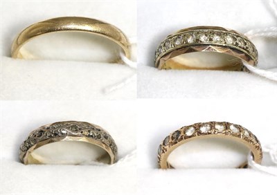 Lot 38 - A 9ct gold band ring, a 9ct gold and silver eternity ring and two further yellow metal eternity...