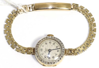 Lot 49 - A lady's gold and diamond set wristwatch