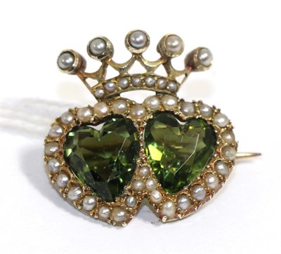 Lot 64 - A green paste and seed pearl double heart brooch, stamped '9CT'