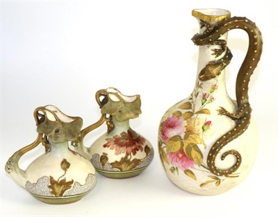 Lot 108 - A Royal Worcester blush grand bottle vase, adorned with entwined serpent in relief, embellished...