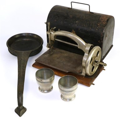 Lot 115 - An Ideal mechanical sewing machine in tin box; an Indian bronze ladle or pan; and a pair of...