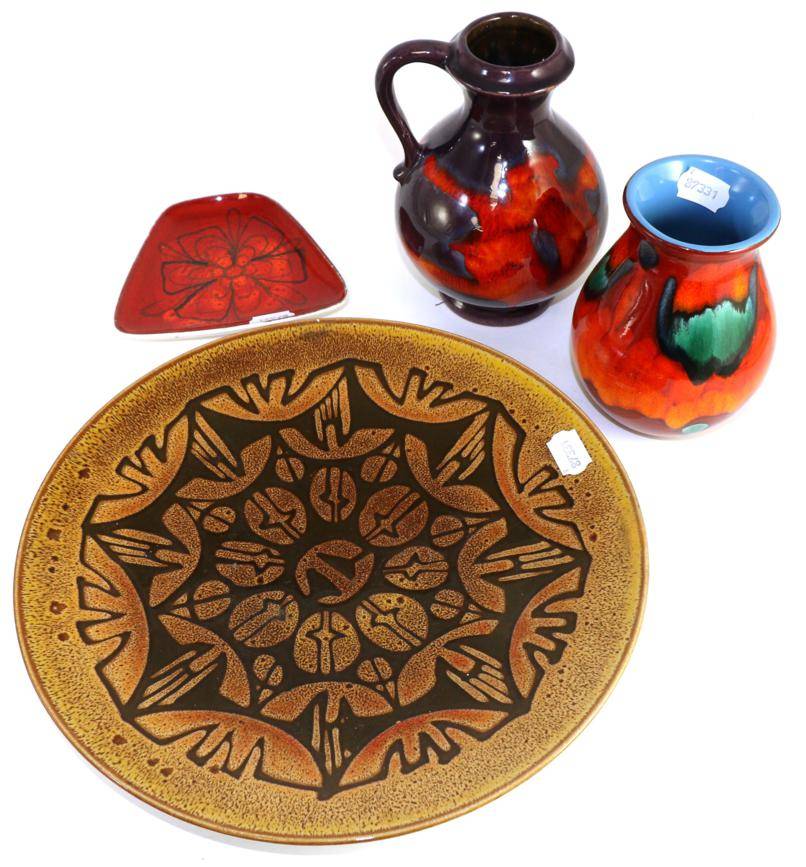Lot 128 - A Poole pottery Aegean pattern charger; a Delphis pattern vase and dish; together with a...
