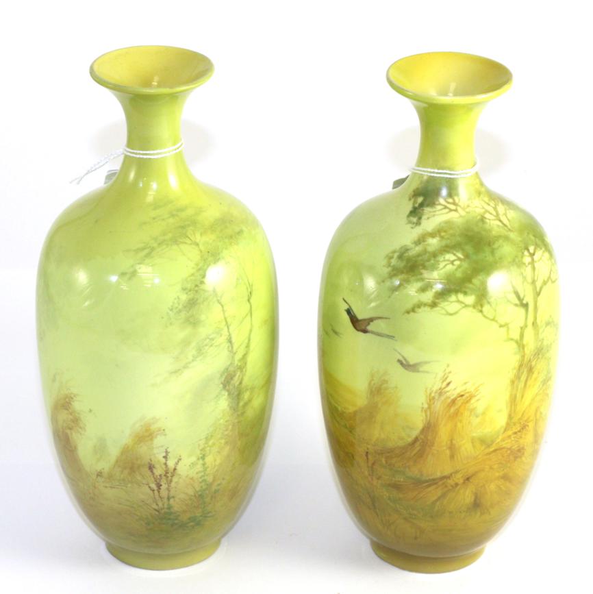 Lot 134 - A pair of Royal Worcester vases signed Sedgeley (both restored)