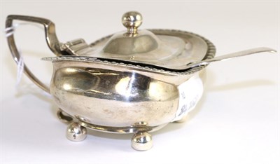 Lot 136 - A George III silver mustard pot, by A.B., London 1789, hinged lid, gadrooned rim; with...