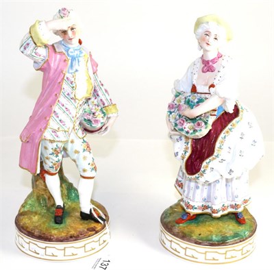 Lot 137 - A pair of continental porcelain figures, blue crossed swords mark to base