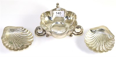 Lot 140 - A pair of shell form silver dishes together with a silver dish raised on three C-scroll feet