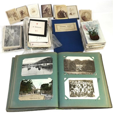 Lot 158 - A quantity of postcards including some in an album