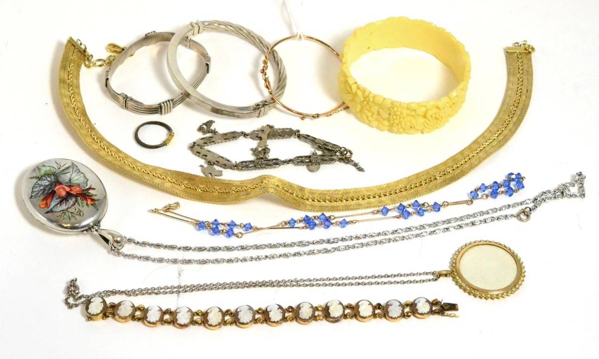 Lot 182 - A cameo bracelet, a bangle, an elephant hair ring, two silver bangles, a locket and costume...