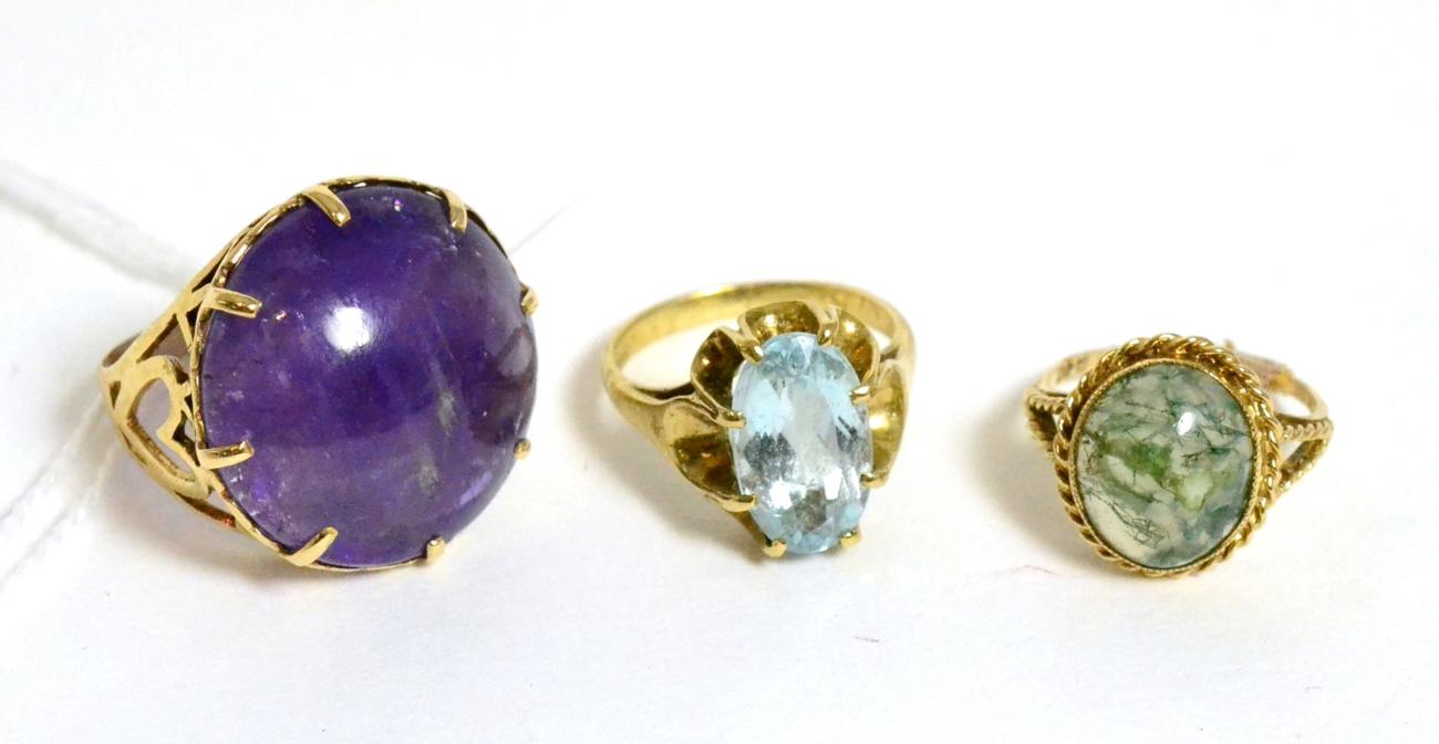 Lot 187 - A 9ct gold amethyst ring, a 9ct gold moss agate ring and an aquamarine ring (3)
