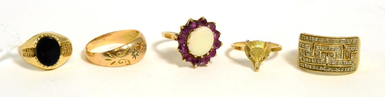 Lot 189 - A fox head ring and four 9ct gold gem set rings (5)