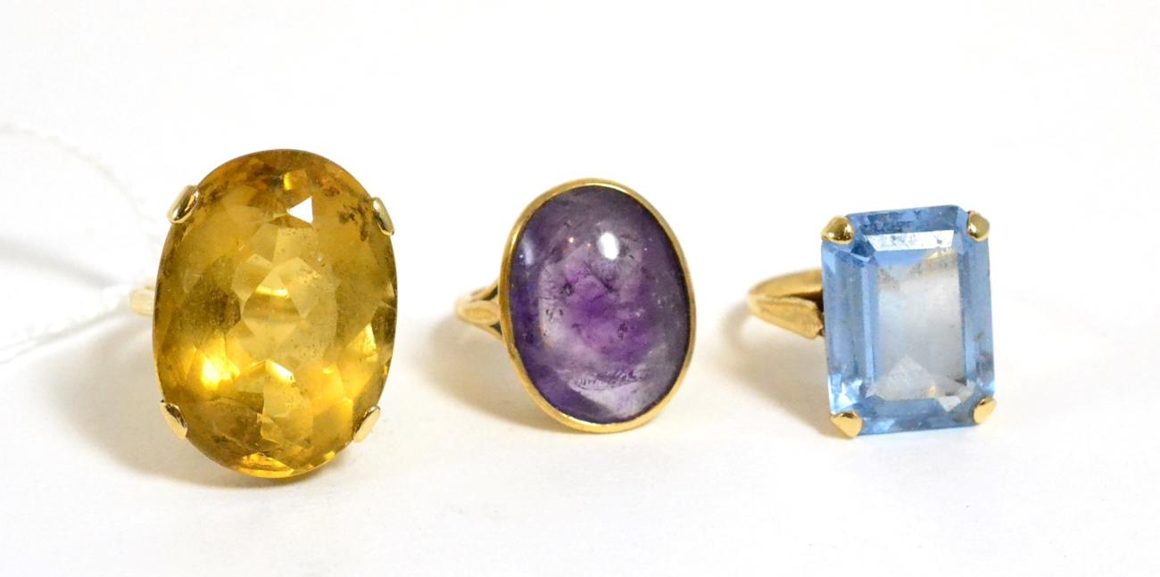 Lot 190 - A citrine ring, an amethyst ring and a 9ct gold blue topaz ring (3)