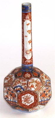 Lot 200 - Imari porcelain bottle vase, Meiji period, with panelled body, typically painted with foliage,...