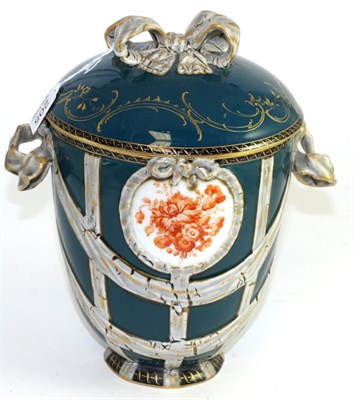 Lot 205 - A 19th century KPM porcelain vase and cover with ribbon tied handles and knot and painted with...