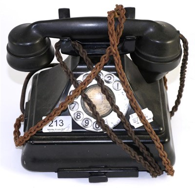 Lot 213 - A 1930's bakelite cased telephone and a carved oak barometer