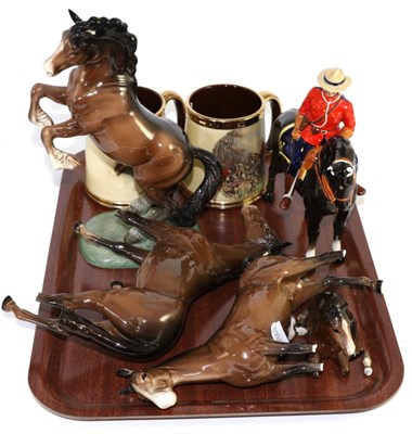 Lot 223 - Beswick Canadian Mountie, model No. 1375, black gloss, together with three bay Beswick horses,...