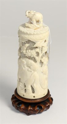 Lot 238 - A Japanese ivory tusk vase and cover, Meiji period, pierced with tigers attacking an elephant...