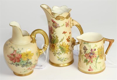 Lot 241 - Three Royal Worcester blush ivory jugs with floral decoration