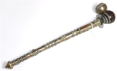 Lot 245 - A Thai white metal opium pipe, with globular wood bowl, the haft with applied filigree tendrils and