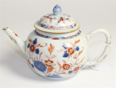 Lot 247 - A Chinese Imari teapot and cover, 18th century, globular form painted with foliage, 13cm high