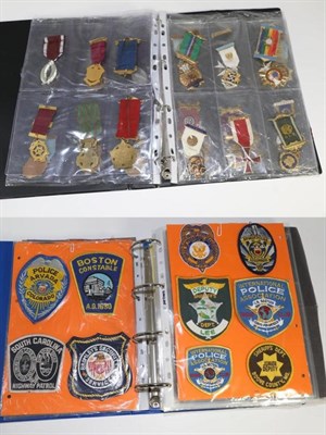 Lot 253 - An album of cloth and other badges, including military, police and Boy Scout examples, and...