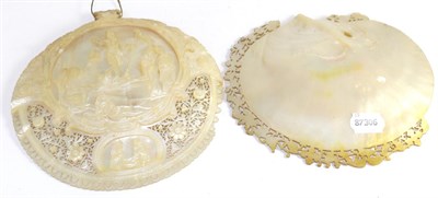 Lot 263 - A mother of pearl shell, carved and pierced with a religious scene, together with another with...