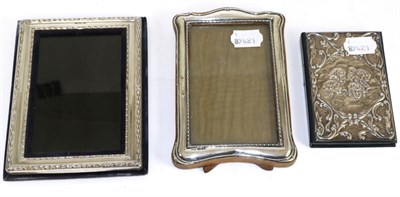 Lot 266 - An early 20th century silver mounted oak photograph frame, a further modern example, boxed and...