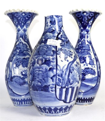 Lot 284 - A pair of Arita porcelain baluster vases, Meiji period, 37cm high and a similar vase (a.f.) (3)