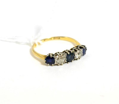 Lot 289 - A sapphire and diamond five stone ring, total estimated diamond weight 0.45 carat...