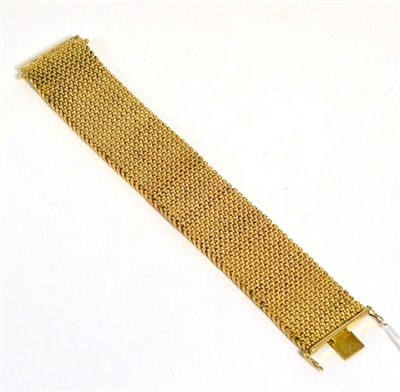 Lot 299 - A broad bracelet stamped '750'