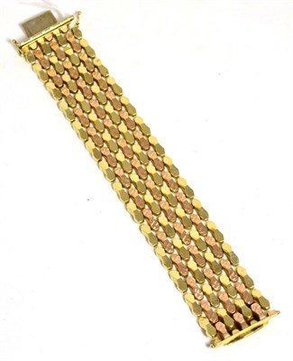 Lot 312 - A cased two colour gold bracelet, stamped '585'