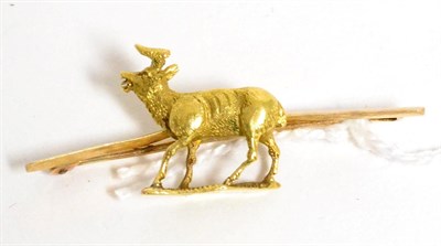Lot 314 - A stag bar brooch, the stag realistically modelled in a walking pose with an open mouth, to a knife