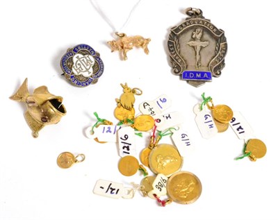 Lot 316 - A 9ct gold fish charm, a 9ct gold bull charm, twelve various 9ct gold medallion charms, a...