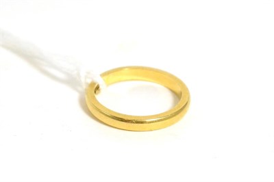 Lot 318 - An 18ct gold band ring, finger size M