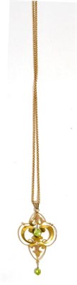 Lot 324 - An Art Nouveau peridot necklace, stamped '9CT'