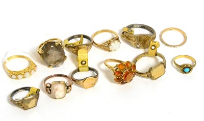 Lot 326 - An 18ct gold ring, a 9ct gold citrine cluster ring, a 9ct gold smokey quartz ring, a 9ct gold...