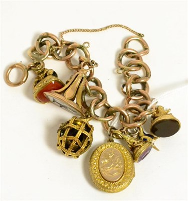Lot 330 - Charm bracelet set with eight charms including a cage