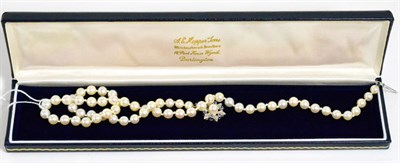 Lot 341 - A cultured pearl necklace with a sapphire set 18ct white gold clasp