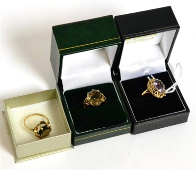 Lot 346 - A 9ct gold amethyst ring and two 9ct gold smokey quartz rings (3)