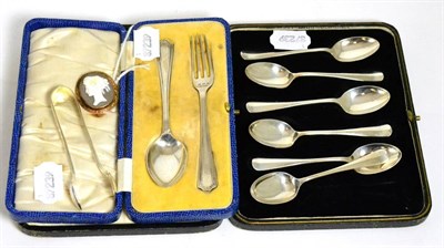 Lot 351 - A set of six silver coffee spoons; a silver christening spoon and fork; a pair of silver sugar...