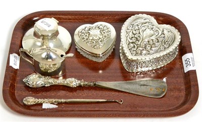 Lot 355 - An American silver heart shaped box; a silver topped glass box; inkwell; mustard; button hook etc