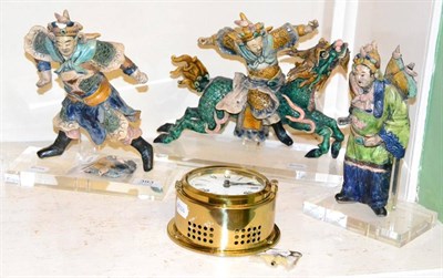 Lot 393 - A group of three Chinese glazed pottery figural ornaments, perspex bases