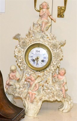 Lot 394 - A late 19th century German floral encrusted porcelain clock with Lenzkirch cylinder movement