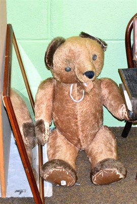 Lot 407 - Large straw filled jointed teddy bear with open mouth, 76cm