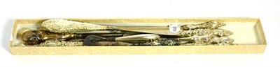Lot 413 - Nine assorted silver mounted button hooks, each with rococo style c scroll decoration to the...