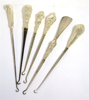 Lot 417 - A rare double ended silver mounted button hook/shoe horn, 33cm long, together with five other large