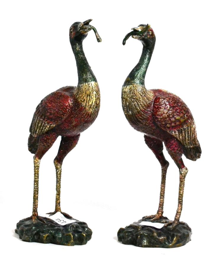 Lot 434 - A pair of Oriental cast figures of cranes