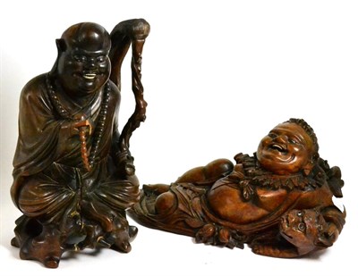 Lot 440 - Two oriental carved hardwood figures