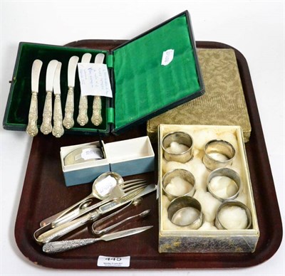 Lot 445 - Silver comprising two cased sets of knives, seven various napkin rings and a small quantity of...